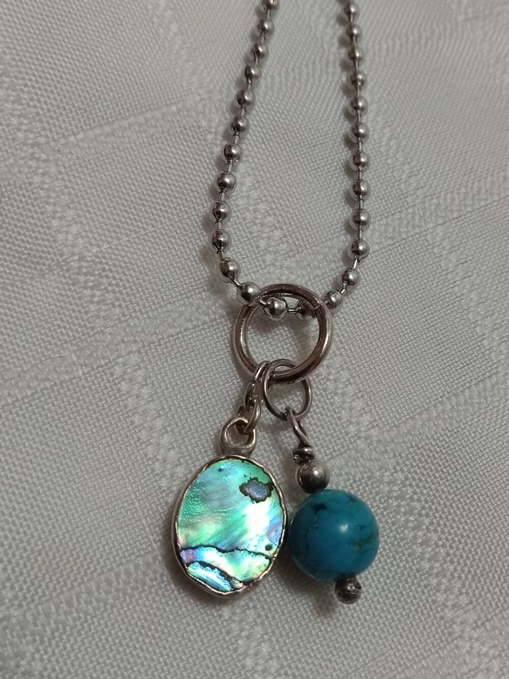 A handmade chain with 2 small Sterling silver 925 pendants